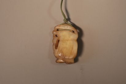 CHINA, About 1900
Three jade (nephrite) pendants...