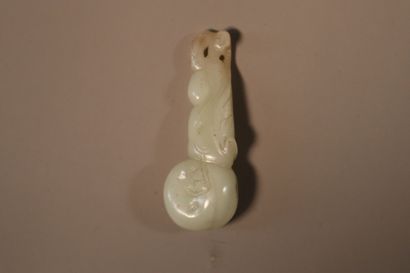 CHINA, About 1900
Three jade (nephrite) pendants...