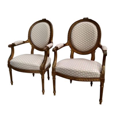 Suite of chairs in the Louis XVI style including...