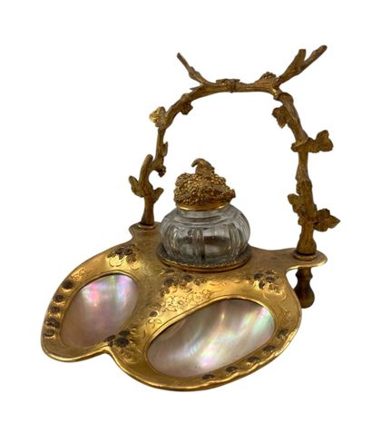 Bronze inkwell with carved decoration representing...