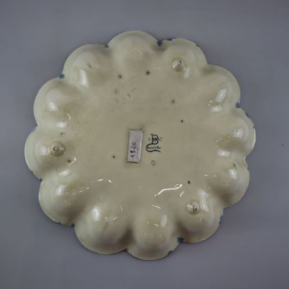 Blue ceramic egg dish with stylized floral...