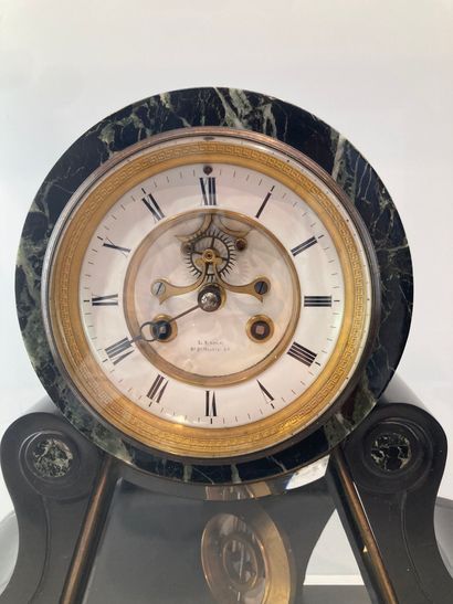 Black marble clock with white and green veins,...