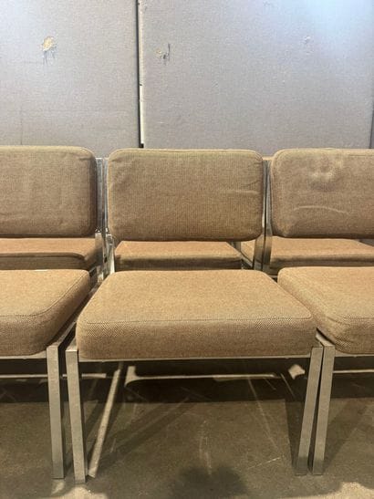 Suite of 12 chrome-plated metal-base armchairs....