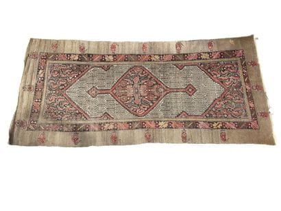 Large woollen rug with an old rose background...