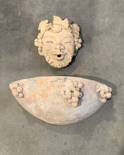 Terracotta fountain decorated with Bacchus...
