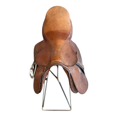 Leather horse saddles and riding equipment.

Please...