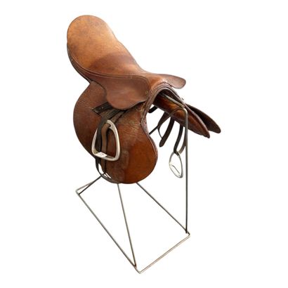 Leather horse saddles and riding equipment.

Please...