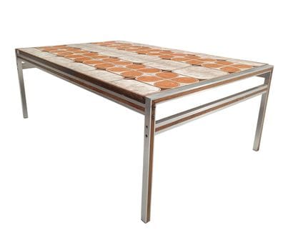 A metal table with a ceramic tile top - Circa...