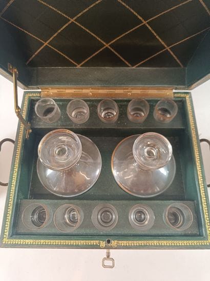 Leather liquor cabinet containing two bottles...