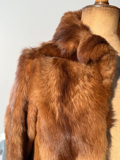 Long-sleeved fur jacket
Height: 80 cm
(tears...
