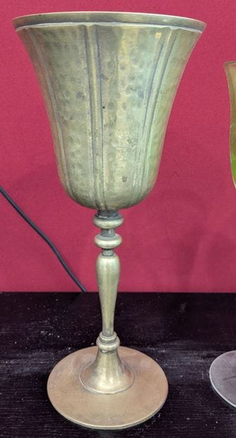 Set of glasses accompanied by two small figurines...