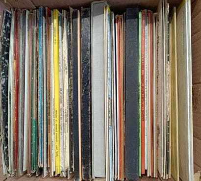 A collection of about sixty vinyl records...