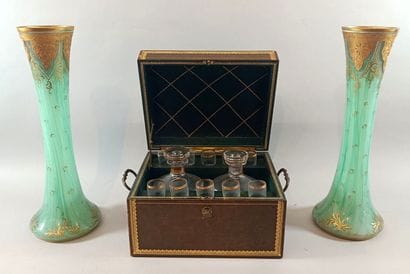 Leather liquor cabinet containing two bottles...
