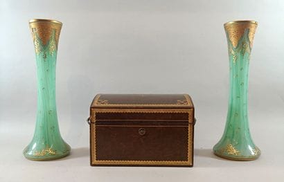Leather liquor cabinet containing two bottles...