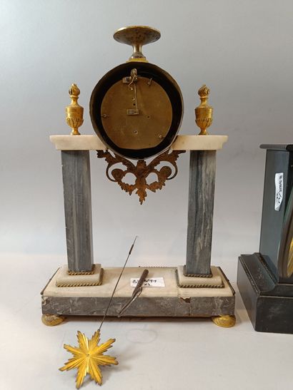 Set of two white and black marble clocks...