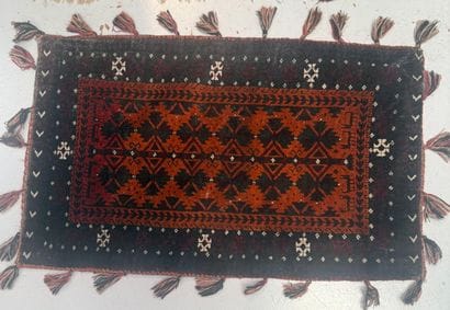 Set of four wool rugs with geometric patterns
ranging...