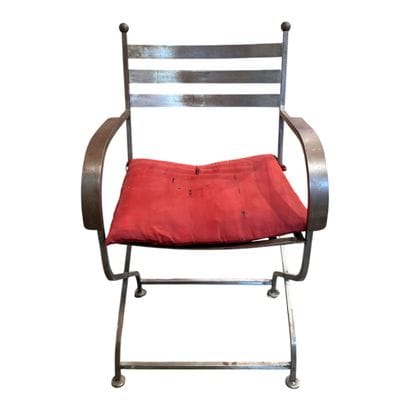 Wrought-iron armchair with a red seat.
H:...