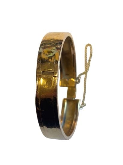 Bracelet jonc en or jaune 18k articulé, et...
