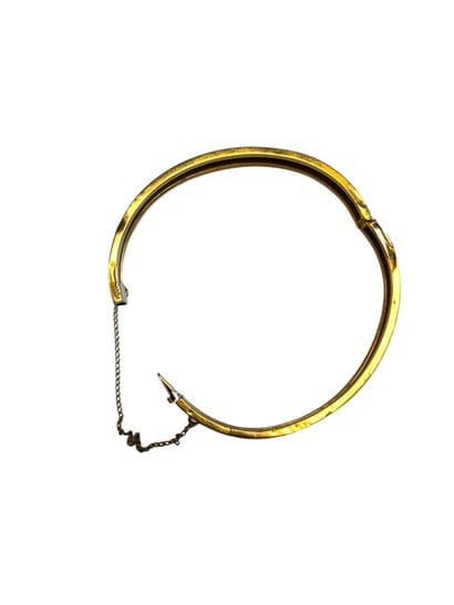 Bracelet jonc en or jaune 18k articulé, et...