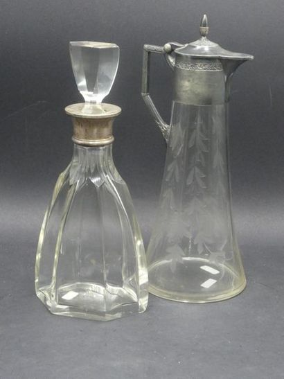 Cut crystal decanter. Silver strapping. Height:...