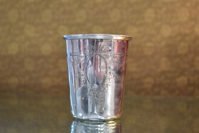 A minerva silver tumbler decorated with crossed...