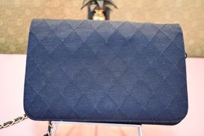 CHANEL. Navy blue jersey clutch bag with...