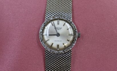 EXACTUS. Montre de dame en or gris et lunette...