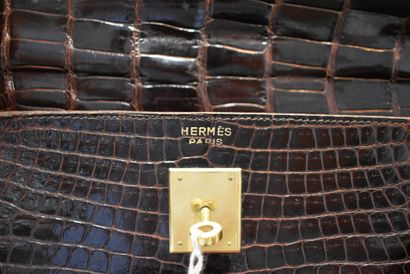 HERMES. 32cm Kelly bag in brown porosus crocodile,...