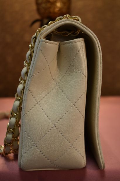 CHANEL Paris. Flap bag in beige leather partially...