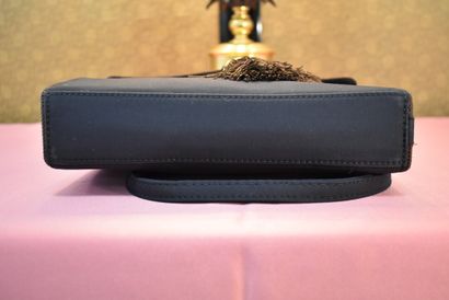 CHRISTIAN DIOR. Clutch bag in black fabric,...