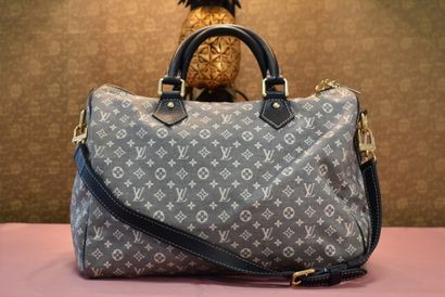 LOUIS VUITTON. Speedy bag, in monogram fabric...