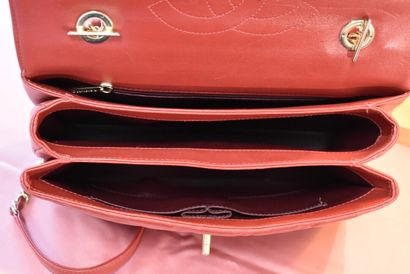 CHANEL. Red quilted lambskin handbag with...
