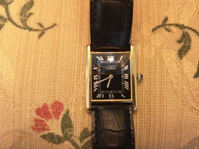 CARTIER. Gold-plated silver must-watch, mechanical...