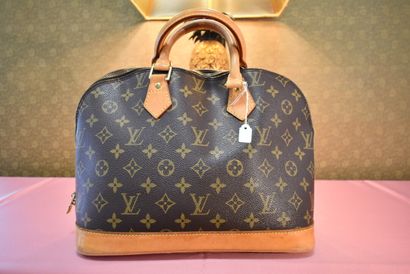 LOUIS VUITTON. Alma model. Handbag in monogram...