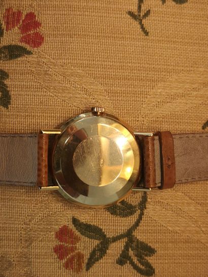OMEGA. Men's automatic watch with gold case...