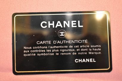 CHANEL. Red quilted lambskin handbag with...