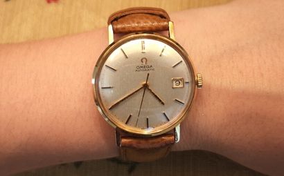 OMEGA. Men's automatic watch with gold case...