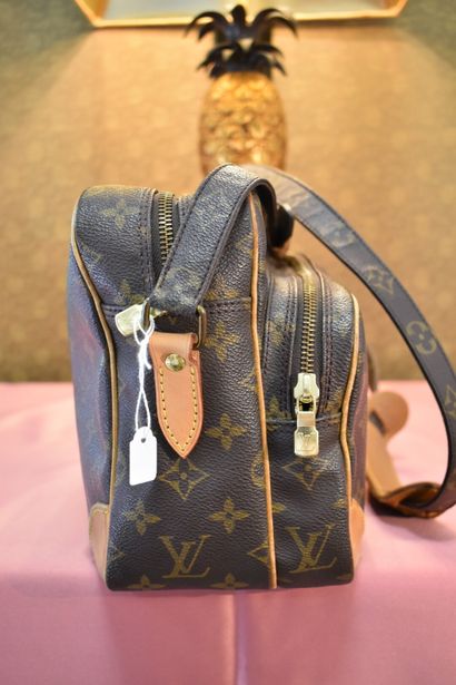 LOUIS VUITTON. Reporter bag in monogram canvas...