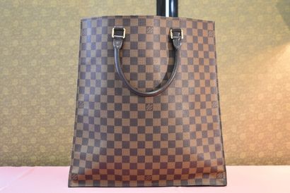 LOUIS VUITTON. Flat bag in checkerboard canvas...