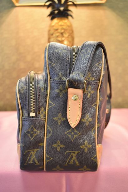 LOUIS VUITTON. Reporter bag in monogram canvas...