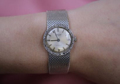 EXACTUS. Montre de dame en or gris et lunette...
