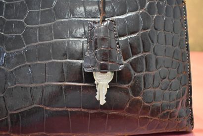HERMES. 32cm Kelly bag in brown porosus crocodile,...