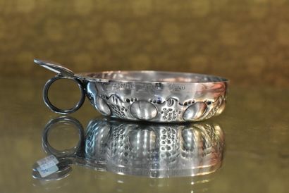 Silver wine tasting vessel with grapes and...