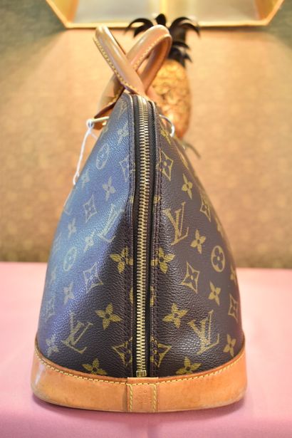 LOUIS VUITTON. Alma model. Handbag in monogram...