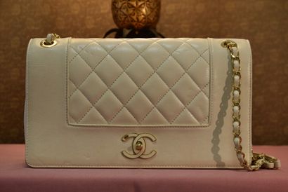 CHANEL Paris. Flap bag in beige leather partially...