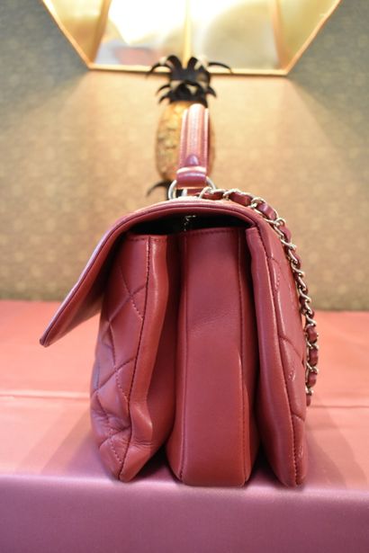 CHANEL. Red quilted lambskin handbag with...