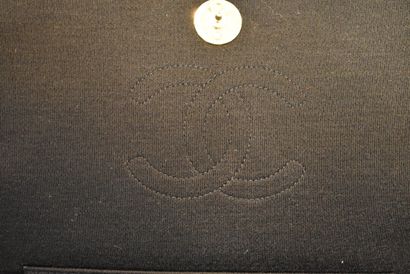 CHANEL. Black jersey clutch bag with flap,...