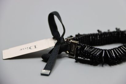 CHRISTIAN DIOR. Bracelet tubes noirs.