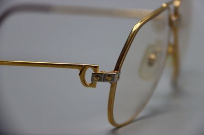 CARTIER, Paris. Paire de lunettes en métal...