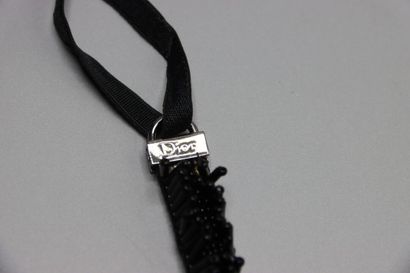 CHRISTIAN DIOR. Bracelet tubes noirs.